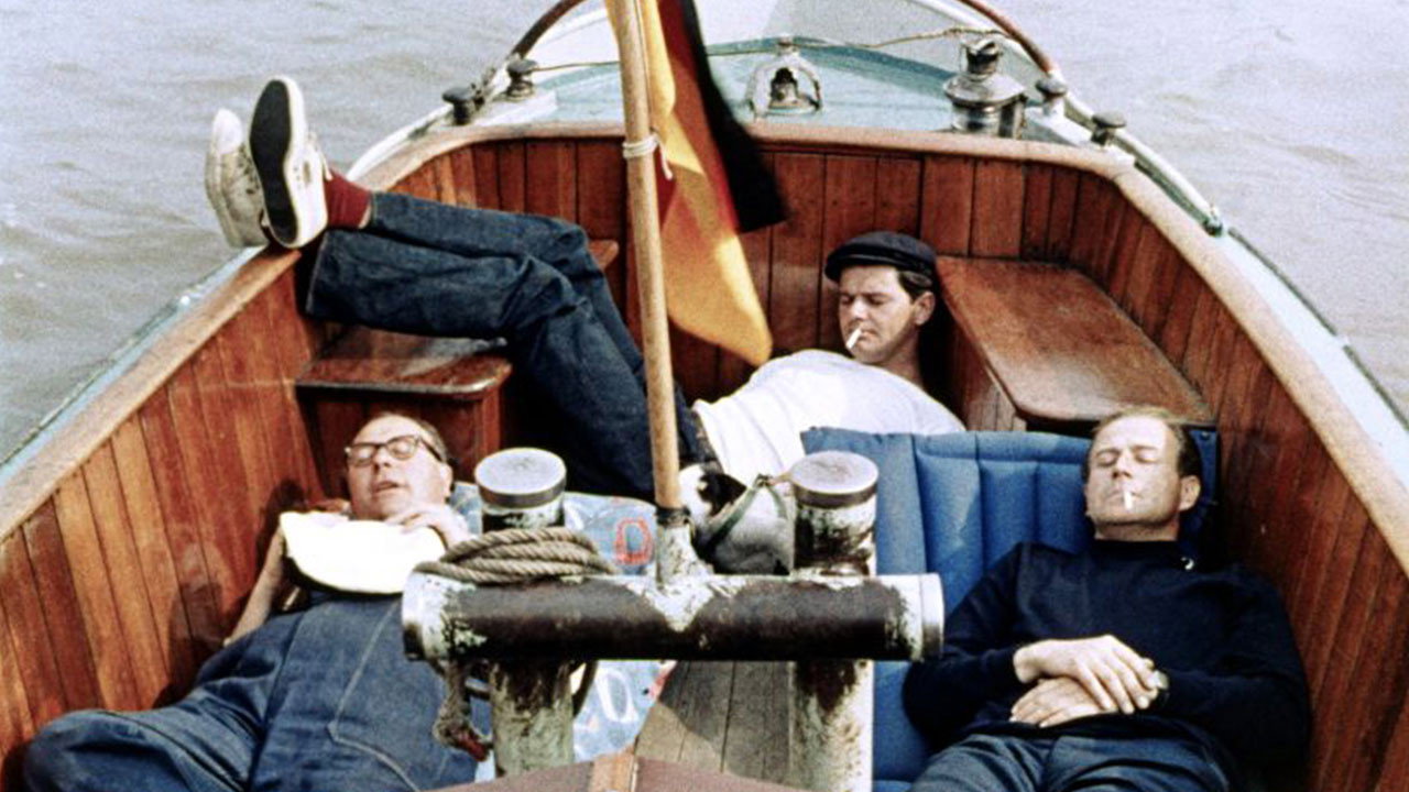 Trois hommes dans un bateau